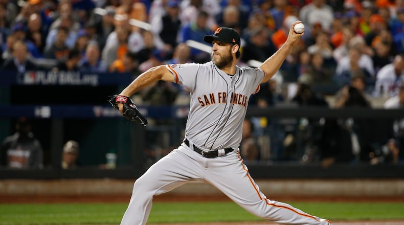 San Francisco Giants starting pitcher Madison Bumgarner (40) delivers against the New York Mets. (AP Photo/Kathy Willens)