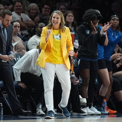 Minnesota Lynx head coach Cheryl Reeve, middle, celebrates during the second half of a WNBA basketball game against the Atlanta Dream Wednesday, May 27, 2026, in Minneapolis. (AP Photo/Abbie Parr)