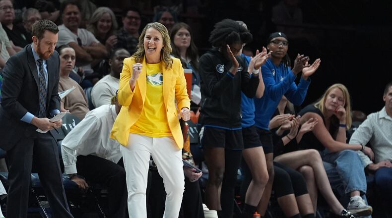 Minnesota Lynx head coach Cheryl Reeve, middle, celebrates during the second half of a WNBA basketball game against the Atlanta Dream Wednesday, May 27, 2026, in Minneapolis. (AP Photo/Abbie Parr)