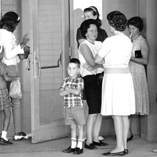 FILE - A group of African American students, left, enter the Boothville-Venice School in Plaquemines Parish, La., on Sept. 12, 1966, as a group of white mothers wait at the entrance of the school. (AP Photo/Jack Thornell, File)