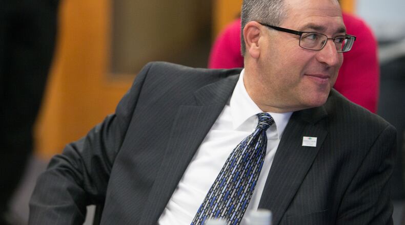 Presiding over the last City Council meeting before leaving office, Mayor Mike Bodker handed his gavel to mayor-elect John Bradberry. BRANDEN CAMP/SPECIAL