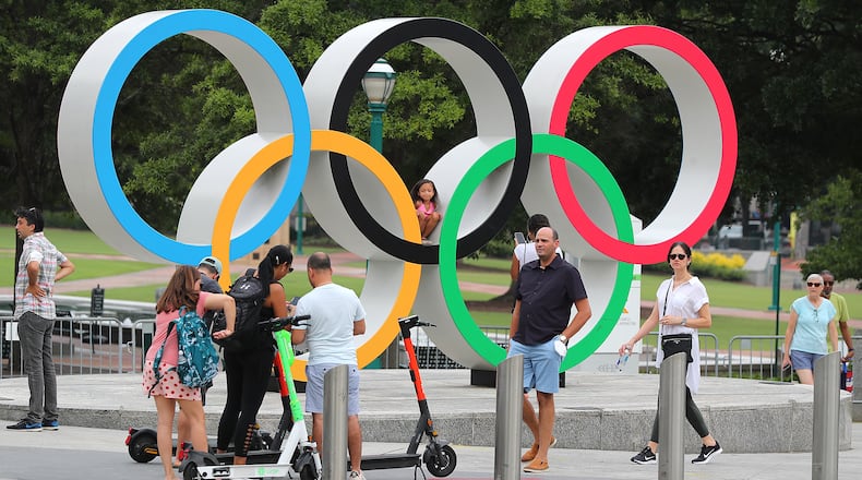080221 Atlanta: Visitors to Centennial Olympic Park take in the Olympic rings on Monday, August 2, 2021, in Atlanta. “Curtis Compton / Curtis.Compton@ajc.com”