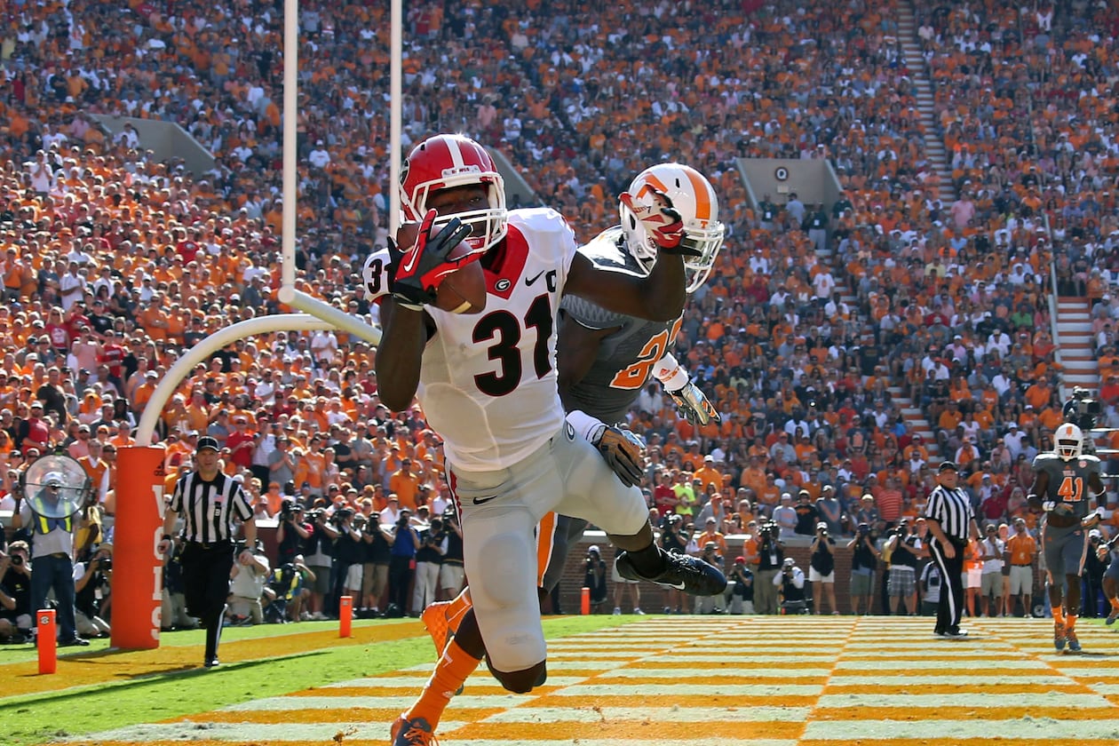 Former Bulldogs wide receiver Chris Conley is well aware of his team’s trials against its crimson nemesis, the struggle that goes back to his own days in red and black. (Jason Getz/AJC 2014)