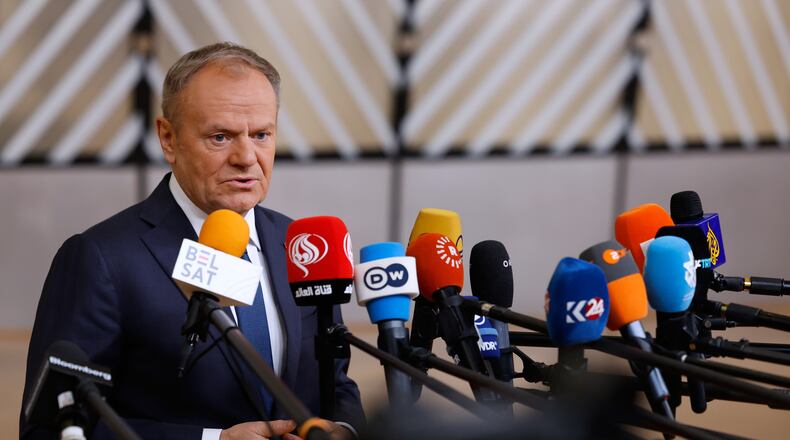 FILE - Poland's Prime Minister Donald Tusk speaks with the media as he arrives for the EU Summit in Brussels, Thursday, Dec. 18, 2025. (AP Photo/Geert Vanden Wijngaert, file)