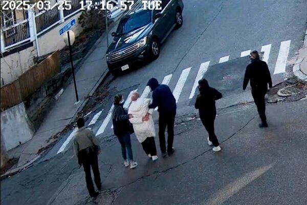 In this image taken from security camera video, Rumeysa Ozturk, a 30-year-old doctoral student at Tufts University, is detained by Department of Homeland Security agents on a street in Sommerville, Mass., Tuesday, March 26, 2025. (AP Photo)