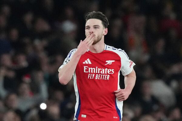 Arsenal's Declan Rice celebrates after scoring his side's second goal during the Champions League quarterfinal first leg soccer match between Arsenal and Real Madrid at the Emirates Stadium in London, Tuesday, April 8, 2025. (AP Photo/Frank Augstein)
