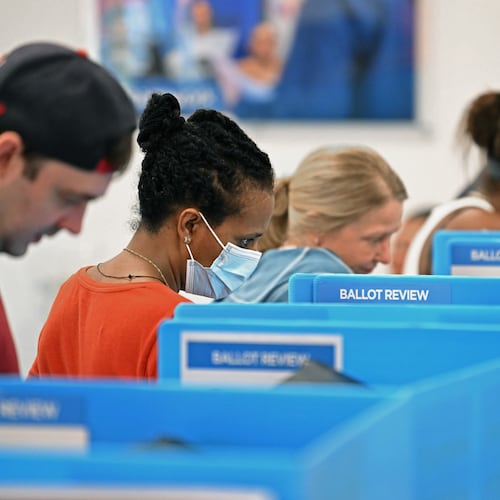 Voters cast their ballots during early in-person voting at the Gwinnett County Voter Registrations and Elections office in Lawrenceville on Wednesday, Oct. 30, 2024, in Lawrenceville. (Hyosub Shin/AJC)