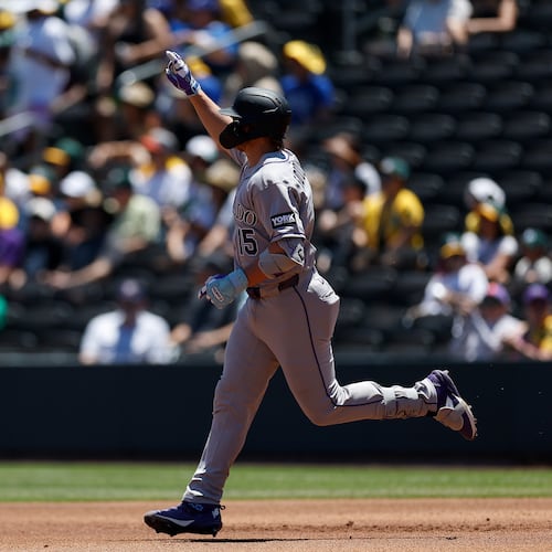 Colorado Rockies' Hunter Goodman rounds the bases after hitting a two-run home run during the first inning of a baseball game against the Athletics, Sunday, June 14, 2026, in Las Vegas. (AP Photo/Caroline Brehman)