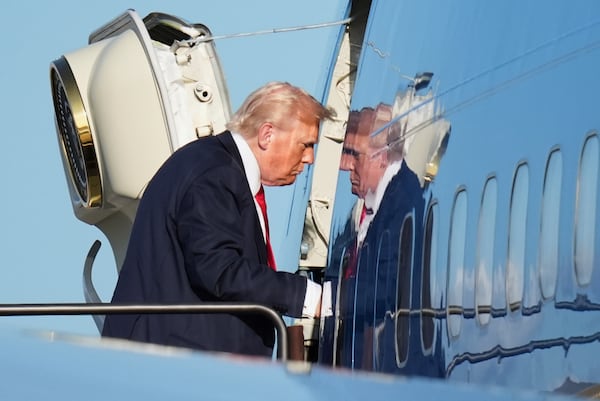 President Donald Trump boards Air Force One, Sunday, July 13, 2025, in Newark, N.J., en route to Washington. (AP Photo/Jacquelyn Martin)