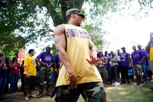 Robert Watkins, 24, from Georgia Southern, dances for his fraternity Omega Psi Phi and others. AJC File