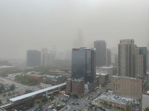 A dust storm that originated in central Illinois moves through downtown Chicago on the evening of Friday, May 16, 2025. (AP Photo/Kathleen Foody)