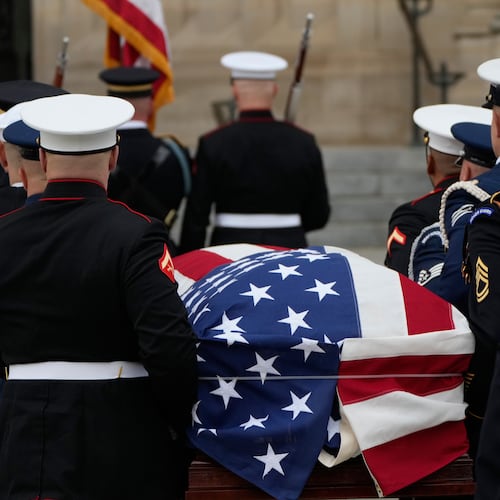 A joint services body bearer team carries the flag-draped casket of former Vice President Dick Cheney into the Washington National Cathedral, Thursday, Nov. 20, 2025, in Washington. (AP Photo/Mark Schiefelbein)