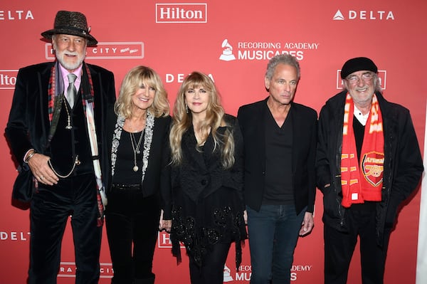 FILE - Honorees Mick Fleetwood, from left, Christine McVie, Stevie Nicks, Lindsey Buckingham and John McVie of Fleetwood Mac arrive at the 2018 MusiCares Person of the Year tribute in New York on Jan. 26, 2018. (Photo by Charles Sykes/Invision/AP, File)