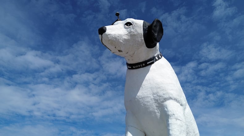 A giant statue of Nipper the dog sits atop a building in the warehouse district in Albany, N.Y., Tuesday, April 21, 2026. (AP Photo/Ted Shaffrey)
