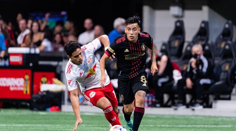 Atlanta United midfielder Ezequiel Barco (8) dribbles against New York Red Bulls Sunday, June 27, 2021, at Mercedes-Benz Stadium in Atlanta. (Dakota Williams/Atlanta United)