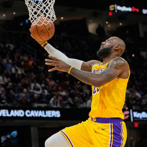 Los Angeles Lakers forward LeBron James goes to the basket in the second half of an NBA basketball game against the Cleveland Cavaliers in Cleveland, Wednesday, Jan. 28, 2026. (AP Photo/Sue Ogrocki)