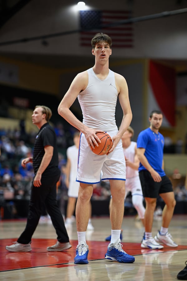 FILE - Florida center Olivier Rioux, center, warms up before an NCAA college basketball game against Wichita State, Friday, Nov. 29, 2024, in Kissimmee, Fla. (AP Photo/Phelan M. Ebenhack, File)