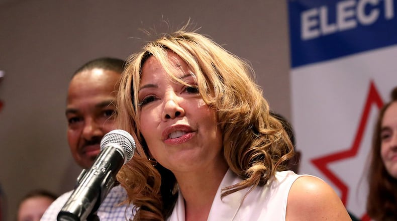 Democrat Lucy McBath speaks to supporters during her watch party Tuesday night as they waited for results in her campaign against U.S. Rep. Karen Handel. The Roswell Republican conceded the race to McBath on Thursday. (JASON GETZ/SPECIAL TO THE AJC)