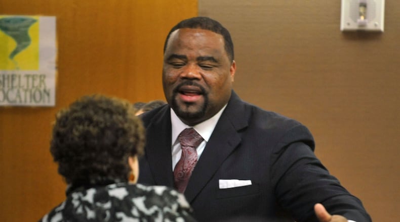 Former APS educator Christopher Waller greets a well wisher after his hearing Monday. Judge Jerry Baxter presides over the first of several days of motions hearings in the APS criminal case, Monday November 4, 2013. Thirty four former APS educators are indicted for crimes associated with cheating on standardized tests. On Monday, three defendants tried to suppress statements they gave GBI agents and special investigators and more will try and do the same on Tuesday. Next week, a number of defendants are trying to sever the case into multiple trials and former APS superintendent Beverly Hall’s motions will be addressed. KENT D. JOHNSON / KDJOHNSON@AJC.COM