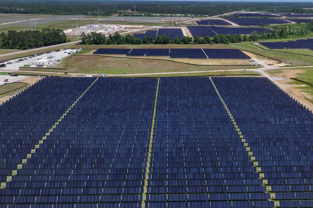 An aerial image shows a large construction site where Silicon Ranch is building one of Georgia’s largest solar farms in one of the state’s smallest counties, on Tuesday, April 21, 2026. A trio of proposals could bring large solar arrays to south Georgia. (Miguel Martinez/AJC)