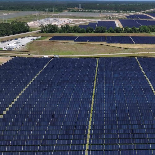 An aerial image shows a large construction site where Silicon Ranch is building one of Georgia’s largest solar farms in one of the state’s smallest counties, on Tuesday, April 21, 2026. A trio of proposals could bring large solar arrays to south Georgia. (Miguel Martinez/AJC)