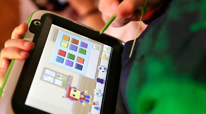 LONDON, ENGLAND - NOVEMBER 06: LeapPad Ultras in use by children attending a media event at St Mary's Church in Marylebone on November 6, 2013 in London, England.