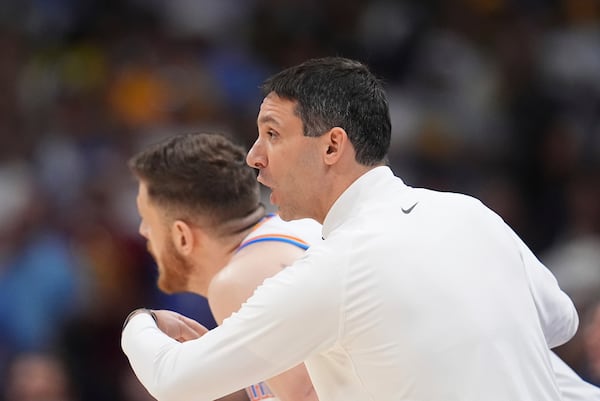 Oklahoma City Thunder head coach Mark Daigneault, right, directs his team as center Isaiah Hartenstein, left, looks down the court in the first half of Game 4 in the Western Conference semifinals of the NBA basketball playoffs against the Denver Nuggets, Sunday, May 11, 2025, in Denver. (AP Photo/David Zalubowski)