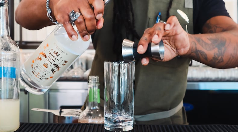 A bartender mixes a cocktail using Queen Huh gin at Minhwa Spirits in Doraville. (Courtesy of Colette Collins)