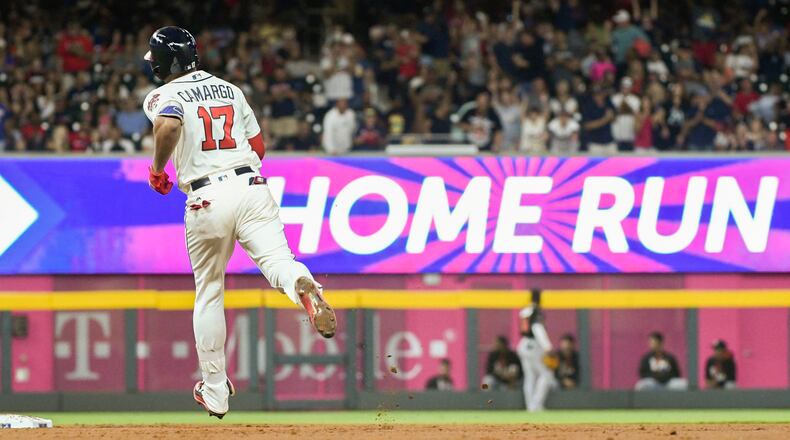 Johan Camargo approaches second base on a two-run home run to left center against the Miami Marlins, Saturday, Sept. 9, 2017, in Atlanta. (AP Photo/John Amis)