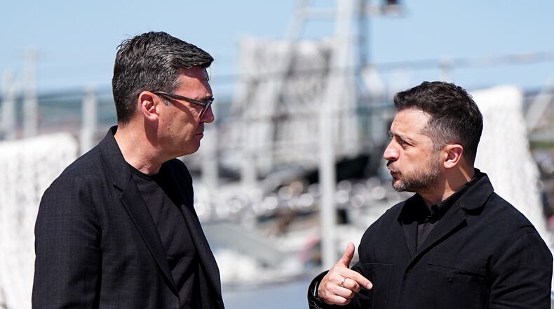 Britain's Prime Minister Andy Burnham, left, and Ukraine's President Volodymyr Zelenskyy view Ukrainian equipment and meet Ukrainian personnel at HM Naval Base in Portsmouth, England, Monday July 27, 2026. (Aaron Chown/Pool Photo via AP)