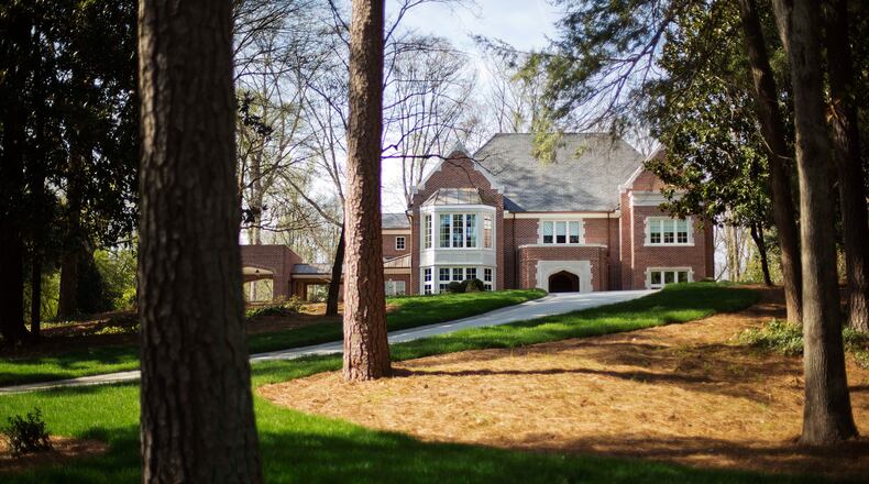 In this March 31, 2014, photo the new $2.2 million mansion that is the residence of Atlanta Archbishop Wilton Gregory stands in the upscale Buckhead neighborhood in Atlanta. Gregory apologized for his spending and offered to put the home up for sale after Pope Francis permanently removed a German bishop for his lavish spending on a renovation project. (AP Photo/David Goldman)