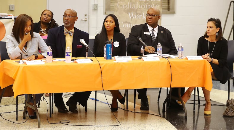 Rashida Winfrey (from left) Tony L. Burks, Adzua Agyapon, Byron Amos and Michelle Olympiadis-Constantinides -- a few of the candidates for District 2 and District 3 seats on the Atlanta Board of Education -- address the audience during an August election forum.    Curtis Compton/ccompton@ajc.com