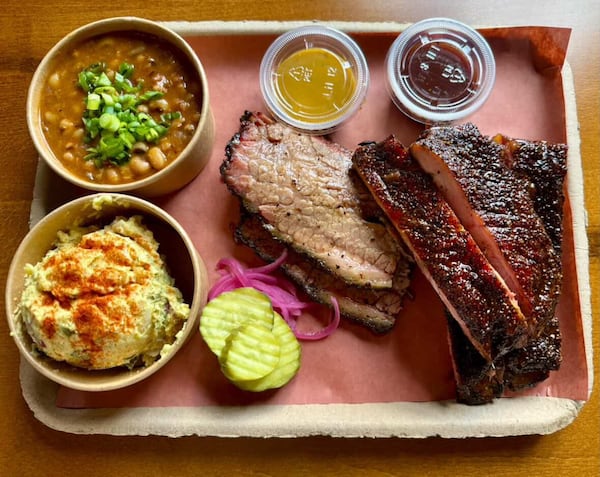 Springfield BBQ’s beef brisket, pork spareribs, black-eyed pea gumbo, deviled egg potato salad, and house pickles and sauces. (Courtesy of Springfield BBQ)