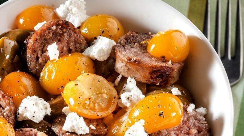 Sweet-as-candy Sun Gold tomatoes offer contrast to the richness of Italian sausage and goat cheese. (Bill Hogan/Chicago Tribune/TNS)
