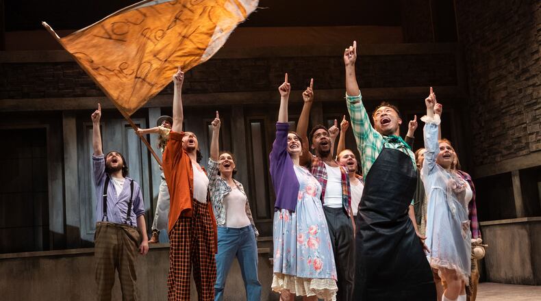Russell Scott (in foreground) leads a social protest in the irreverent musical “Urinetown,” a co-production of Actor’s Express and Oglethorpe University Theatre continuing through Feb. 19.
Courtesy of Actor’s Express/Casey Gardner Ford