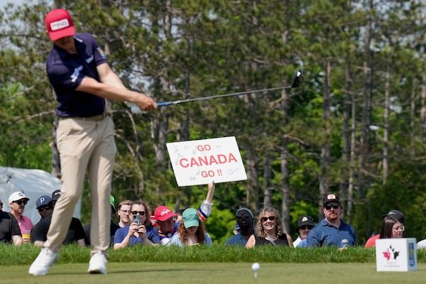 Canadian fans cheer on their national players as Mackenzie Hughes tees off at the 17th hole during the third round of the Canadian Open golf tournament in Caledon, Ontario, Saturday, June 7, 2025. (Nathan Denette/The Canadian Press via AP)