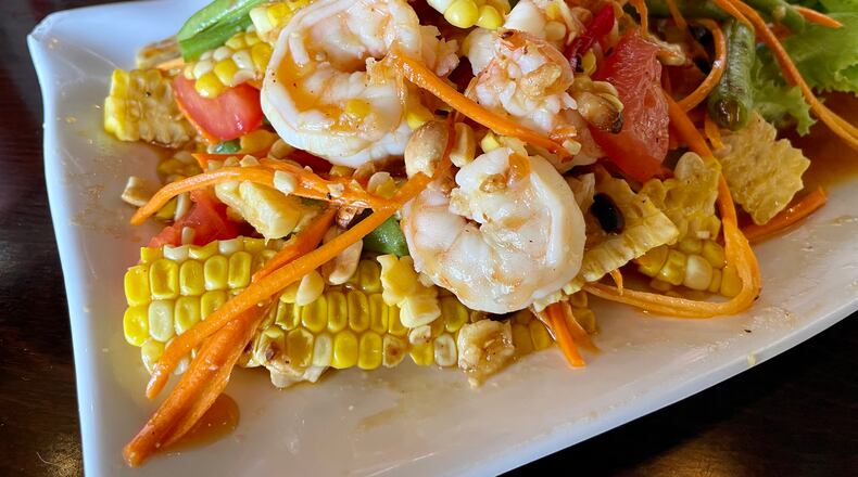 Thai corn salad comes with shrimp at Tum Pok Pok. Angela Hansberger for The Atlanta Journal-Constitution