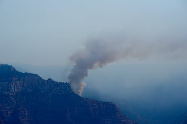 Smoke from the Dragon Bravo Fire moves over the Grand Canyon along the North Rim Tuesday, July 15, 2025, in Grand Canyon National Park, Ariz. (AP Photo/Ross D. Franklin)