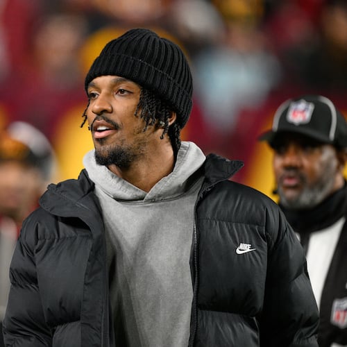 Washington Commanders quarterback Jayden Daniels is seen on the sidelines before an NFL football game against the Denver Broncos Sunday, Nov. 30, 2025, in Landover, Md. (AP Photo/Nick Wass)