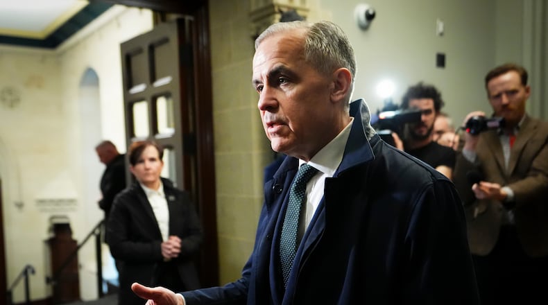 Prime Minister Mark Carney arrives on Parliament Hill in Ottawa on Wednesday, April 22, 2026. (Sean Kilpatrick/The Canadian Press via AP)