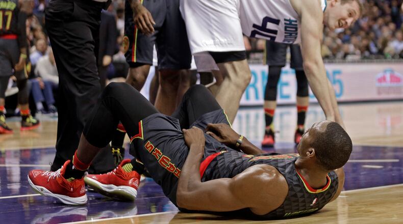 Atlanta Hawks’ Dwight Howard, bottom, is called for a foul on Charlotte Hornets’ Cody Zeller, top, in the second half of an NBA basketball game in Charlotte, N.C., Friday, Nov. 18, 2016. Howard was called for flagrant foul on the play and ejected from the game. The Hornets won 100-96. (AP Photo/Chuck Burton)