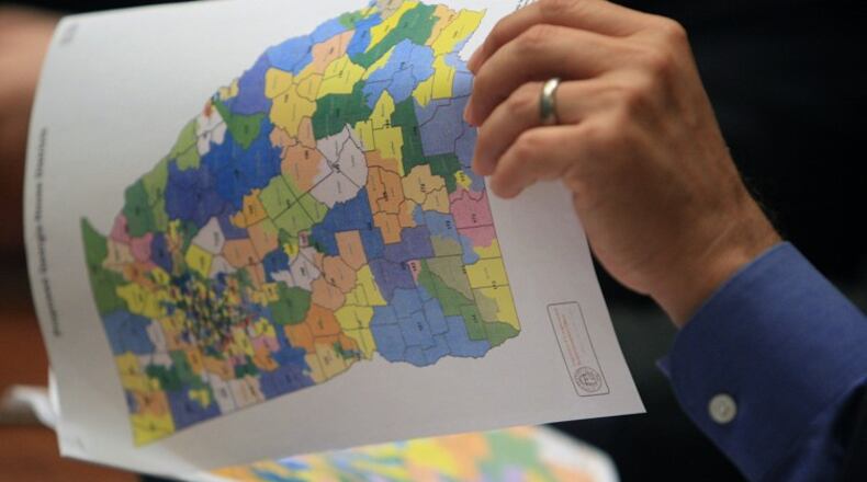 A Georgia lawmaker inspects a redistricting map. AJC file.
