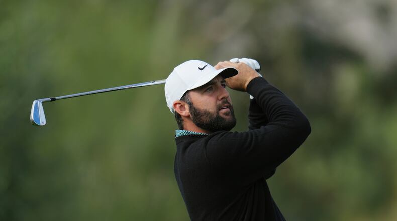 Scottie Scheffler watches his shot from the third tee during the first round of the American Express golf event at La Quinta County Club Thursday, Jan. 22, 2026, in La Quinta, Calif. (AP Photo/Ross D. Franklin)