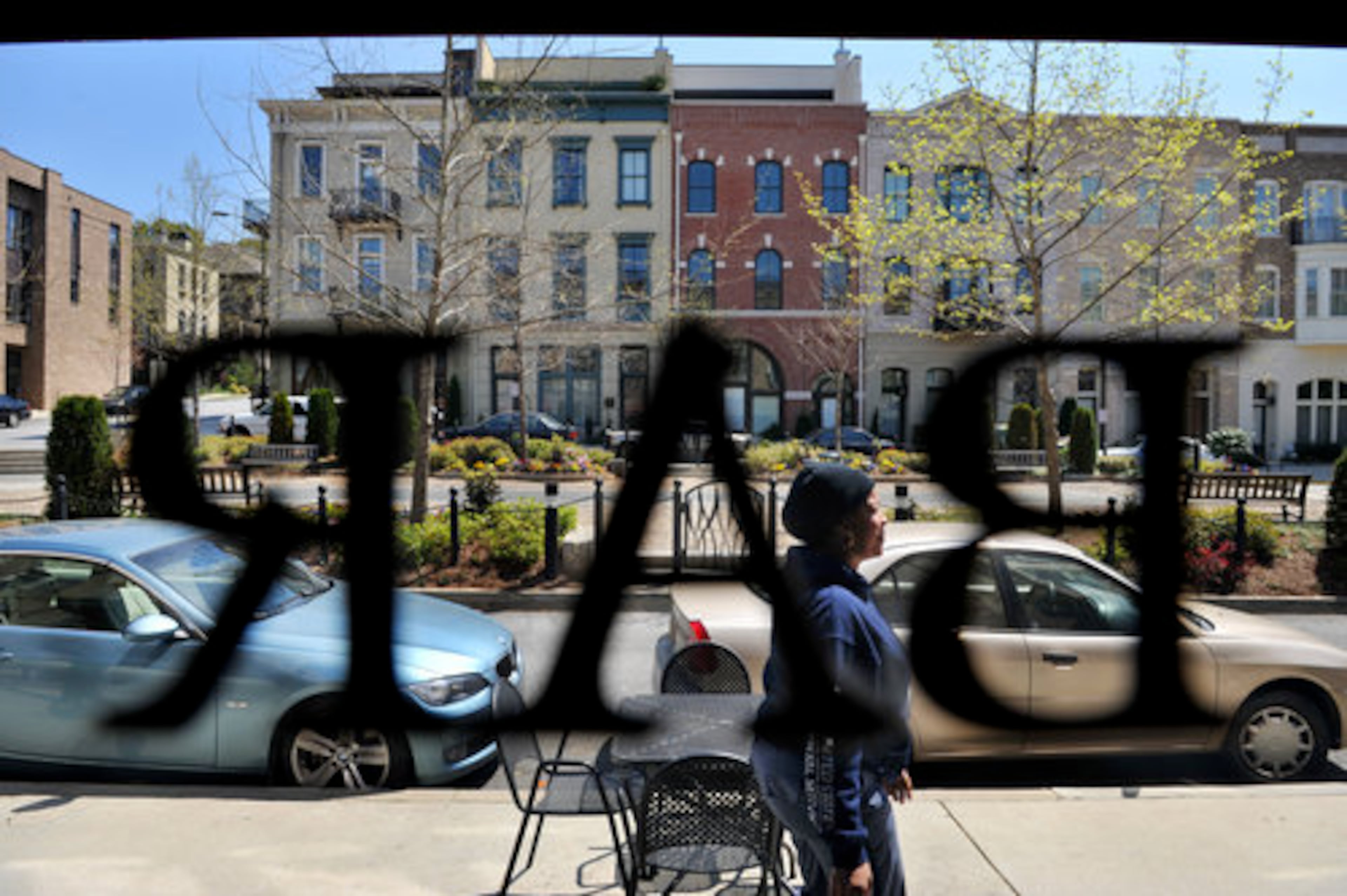 Belinda Ferrell walks past Vickery's bar as she delivers mail in Glenwood Park's retail area. Katharine Kelley will step down as president of Green Street Properties, which is known for helming Atlanta’s Glenwood Park district. (Rich Addicks/AJC 2020)