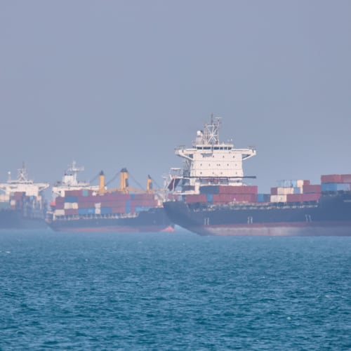 Container ships sit at anchor in the Strait of Hormuz off Bandar Abbas, Iran, Saturday, May 2, 2026.(Amirhosein Khorgooi/ISNA via AP)