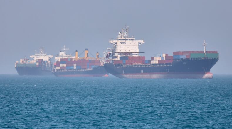 Container ships sit at anchor in the Strait of Hormuz off Bandar Abbas, Iran, Saturday, May 2, 2026.(Amirhosein Khorgooi/ISNA via AP)