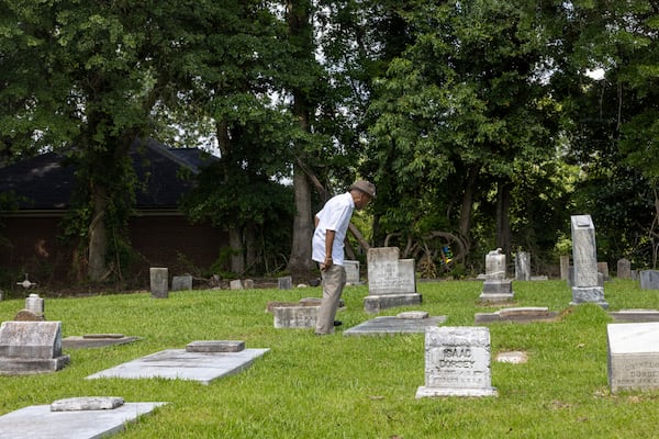 Paul Ponder looks at family graves at the Fayetteville Cemetery in Fayetteville on Tuesday, June 24, 2025. (Arvin Temkar/AJC)