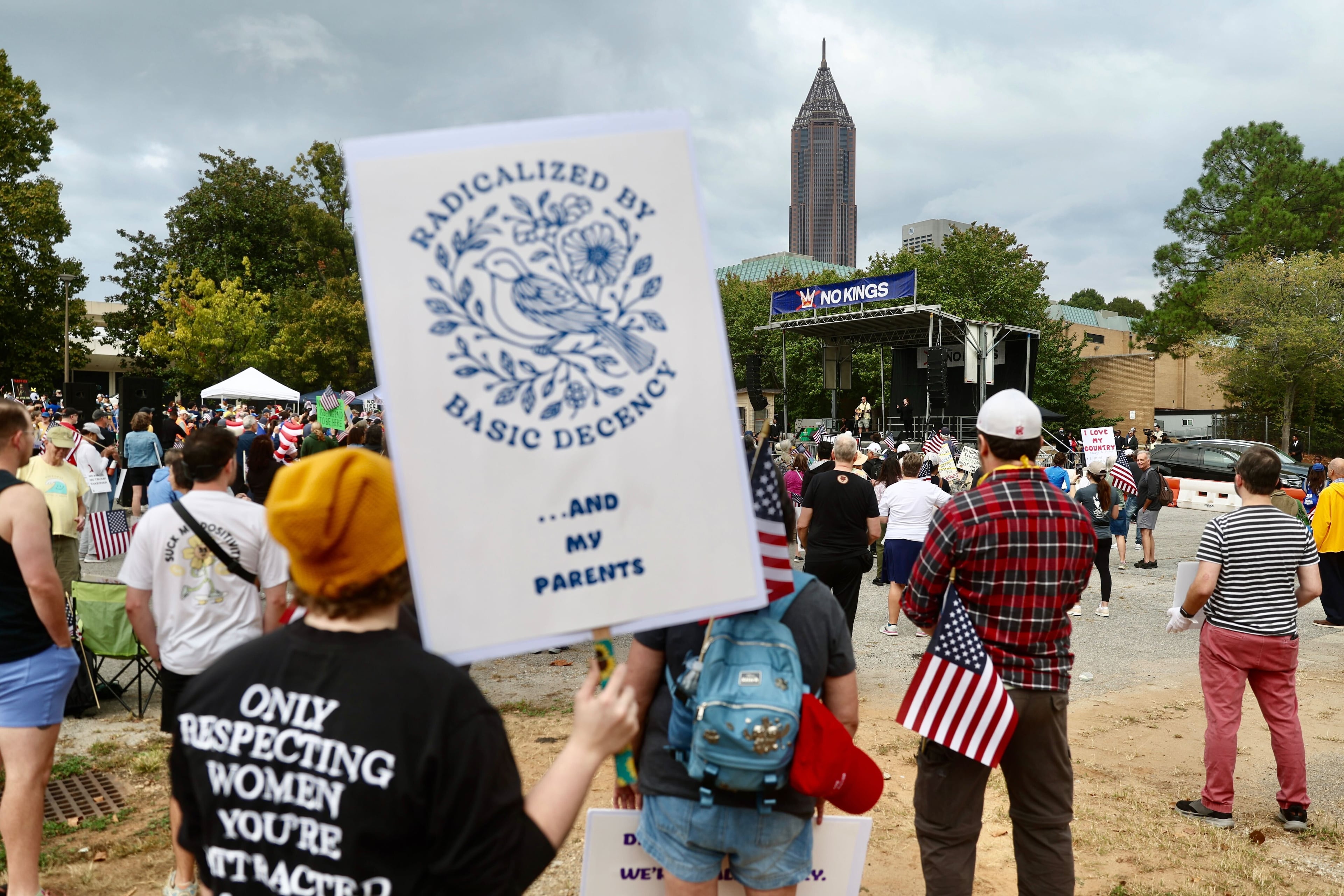 Hundreds of people gathered at the Atlanta Civic Center parking lot Saturday morning for a "No Kings" protest. (Abbey Cutrer / AJC)