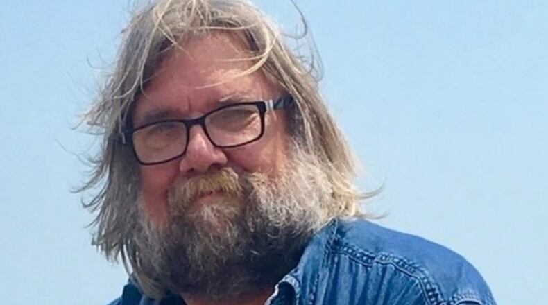 This undated photo released by Emily Joy Schumacher shows Michael Schumacher, a Wisconsin author who produced a diverse array of works ranging from biographies of filmmaker Francis Ford Coppola and musician Eric Clapton to accounts of Great Lakes shipwrecks. (Emily Joy Schumacher via AP)