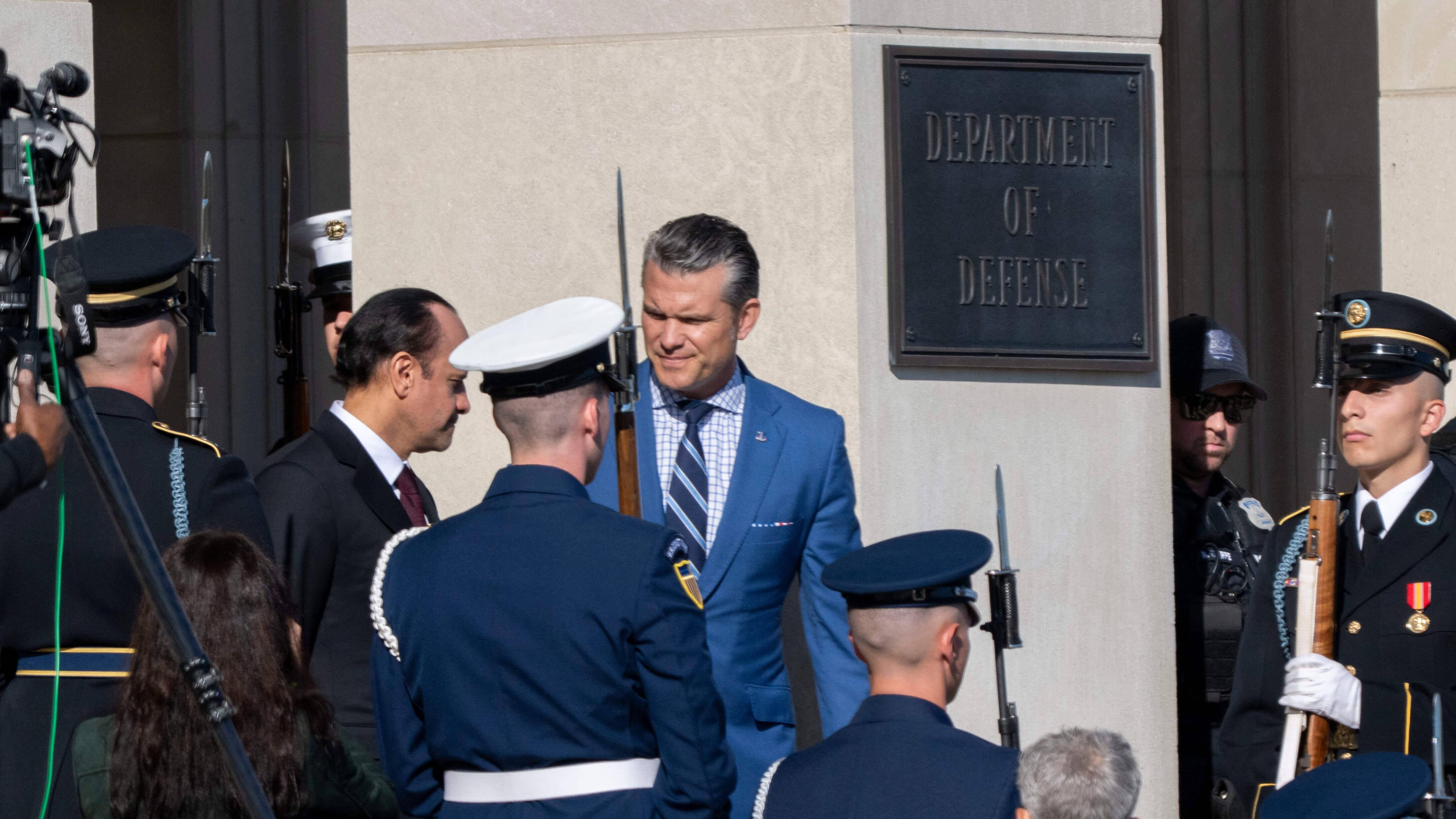 Defense Secretary Pete Hegseth, center, welcomes Qatar Minister of Defense Sheikh Saoud Al Thani to the Pentagon, Friday, Oct. 10, 2025 in Washington. (AP Photo/Kevin Wolf)